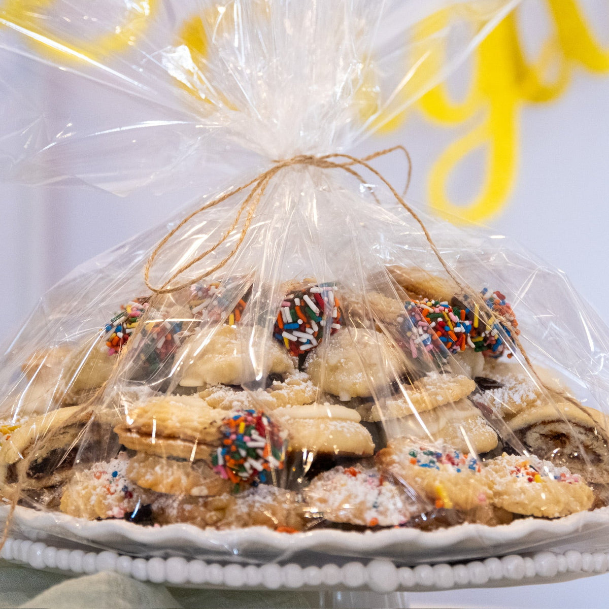 Assorted Italian cookies on a white cake stand