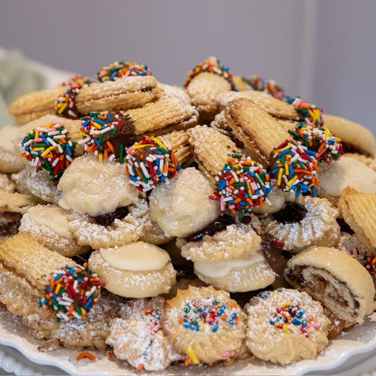Assorted Italian cookies with Happy sign in background